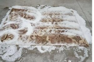 Professional oriental rug cleaning in progress in Ames, Iowa